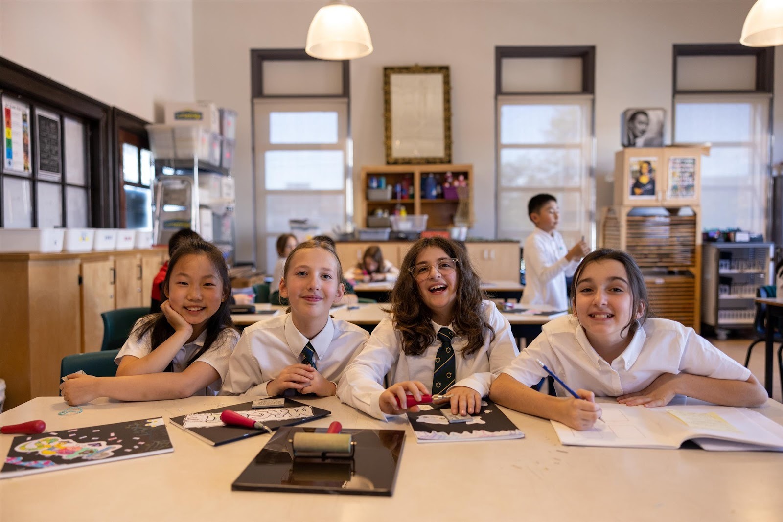 A group of children sitting at a table
AI-generated content may be incorrect.